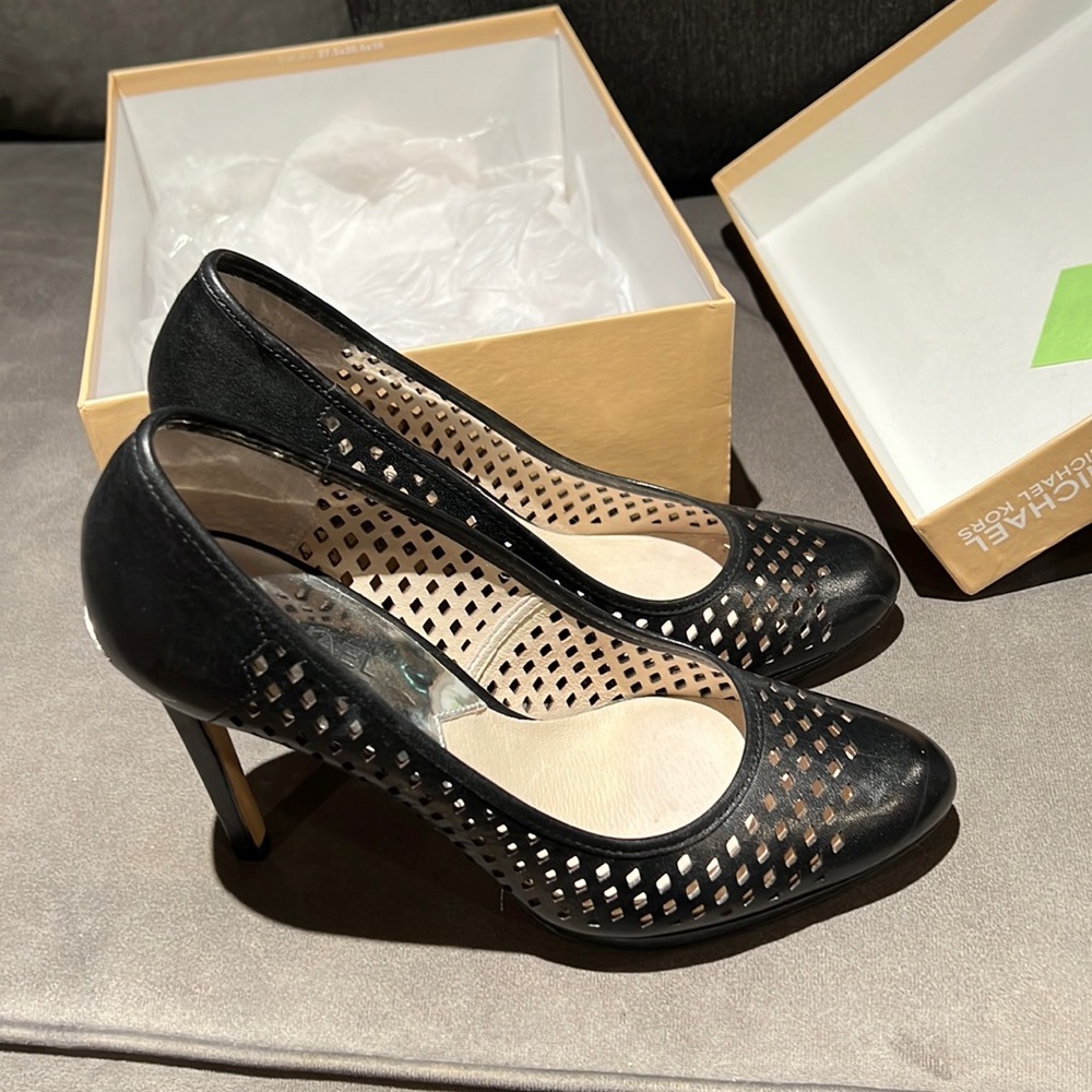 Gently used black Michael Kors high heeled shoes.